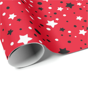 svarta och vita stjärnor på rött presentpapper