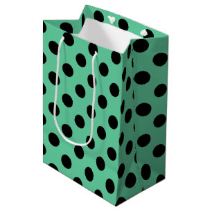Svarta polka dots på mynta grönt