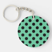 Svarta polka dots på mynta grönt