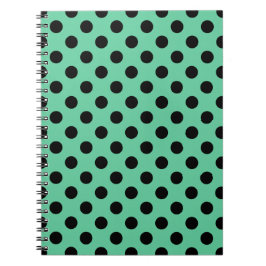 Svarta polka dots på mynta grönt anteckningsbok med spiral