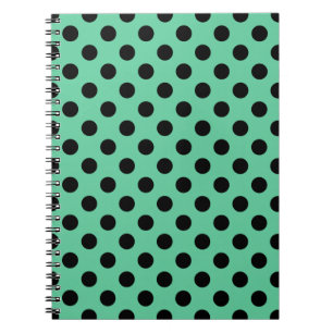 Svarta polka dots på mynta grönt anteckningsbok med spiral