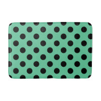 Svarta polka dots på mynta grönt