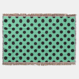 Svarta polka dots på mynta grönt filt