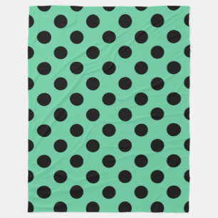 Svarta polka dots på mynta grönt fleecefilt