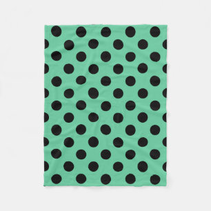 Svarta polka dots på mynta grönt fleecefilt