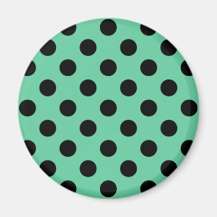Svarta polka dots på mynta grönt magnet