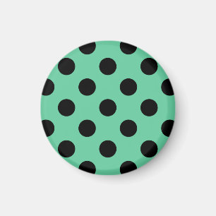 Svarta polka dots på mynta grönt magnet