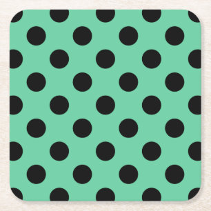 Svarta polka dots på mynta grönt underlägg papper kvadrat