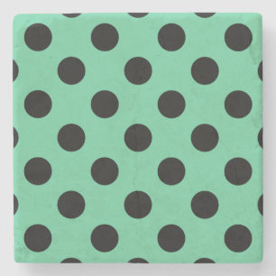 Svarta polka dots på mynta grönt underlägg sten