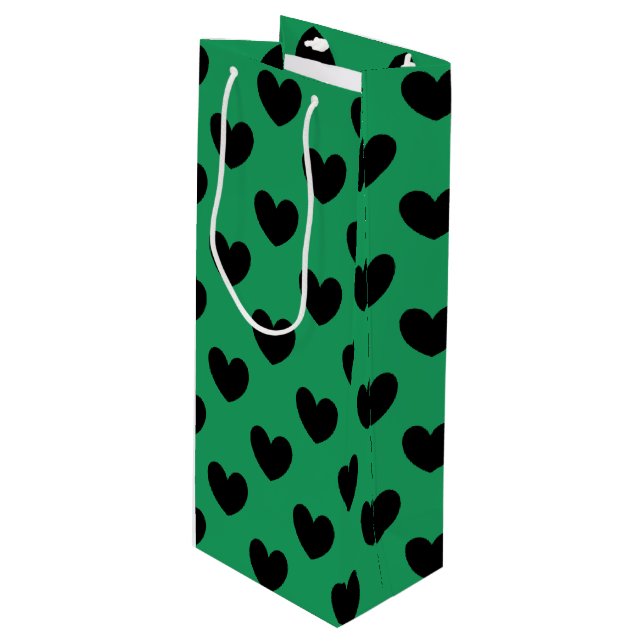 Svarta polka-hjärtan på Kelly grönt (Framsidan Vinklad)