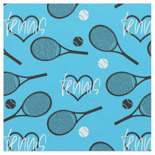 Svarta tennisracketar på blå tyg