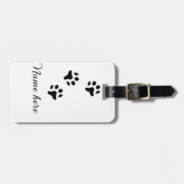 Svartdjuret hund lägger till tass-foto till tass bagagebricka