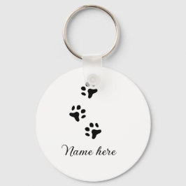 Svartdjuret hund lägger till tass-foto till tass nyckelring