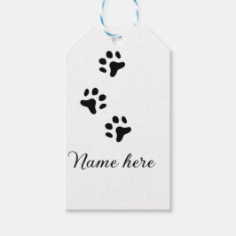 Svartdjuret hund lägger till tass-foto till tass presentetikett