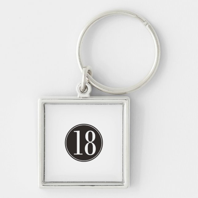 Svarten #18 cirklar (bekläda), fyrkantig silverfärgad nyckelring (Framsidan)