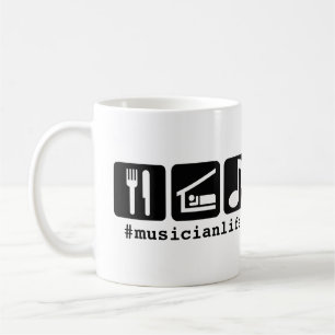 Svarten äter sömnmusiksymboler kaffemugg