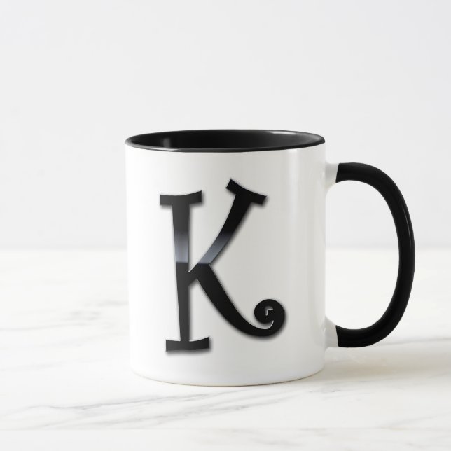 Svarten kommenterar Monogram - K Mugg (Höger)