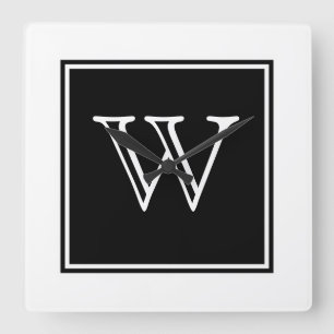 Svarten kvadrerar monogramen tar tid på fyrkantig klocka