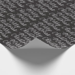 SVARTEN SKRIVAR GOD JUL SOM SLÅR IN PAPPER PRESENTPAPPER