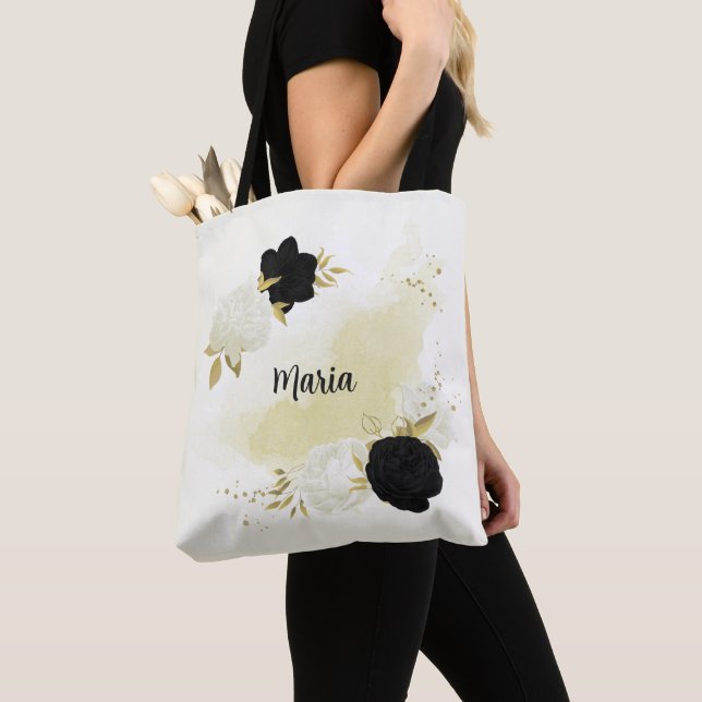 Svartvit blommigt guld tygkasse (Närbild)