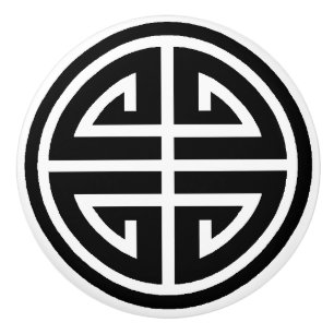 Svartvit kinesisk symbol med runda, keramiska dör knopp
