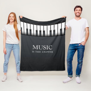 Svartvit modern piano fleecefilt