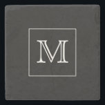 Svartvit monogram stenunderlägg<br><div class="desc">Den här stenens underlägg har en minimal design med din ursprungliga ram i en vit kvadrat på en svart bakgrund</div>