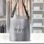 Svartvit skript i Metall silver Brushed Axelväska<br><div class="desc">Den här elegant personligen korsar en säck har ett monogram och första namn i det moderna svartvita manuset på en silver faux borstad metall bakgrund.</div>
