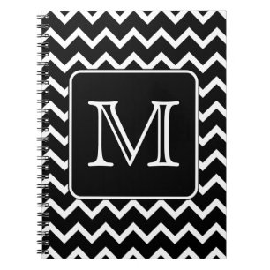 Svartvit sparre med den beställnings- monogram.en anteckningsbok