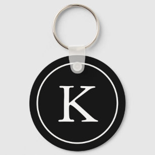 Svartvitt cirkla den initiala monogramen nyckelring