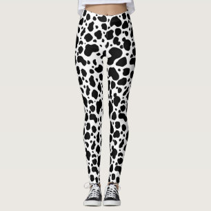 Svartvitt djurt tryck för kofläckmönster leggings