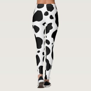 Svartvitt djurt tryck för kofläckmönster leggings