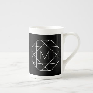 Svartvitt geometriskt monogram benporslin mugg