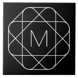 Svartvitt geometriskt monogram kakelplatta
