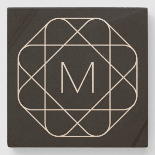 Svartvitt geometriskt monogram stenunderlägg