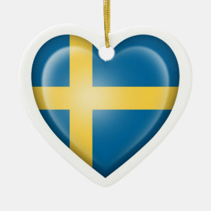 Svensk hjärtaflagga på vit julgransprydnad keramik