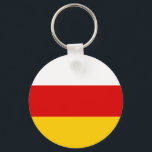 Sydossetiens flagga nyckelring<br><div class="desc">Patriotisk flagga för Sydossetien.</div>
