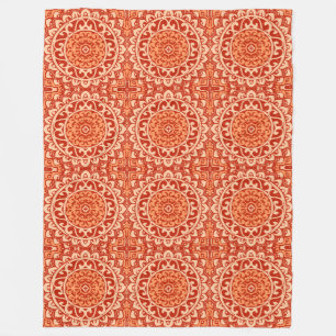 Sydvästlig solmandala batik, korallorange fleecefilt