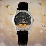 Syster World's best black guld bow Armbandsur<br><div class="desc">Elegant, klassisk, glamorös och feminin. En faux guld färgad och ribbon, lite av lek och lyx för en födelsedag eller julklapp till din syster. Chicens svarta bakgrund. Med texten: Världens bästa syster. Golden klocka från 9 till 3. Den här klockan finns också tillgänglig i vår butik med lila eller faux...</div>