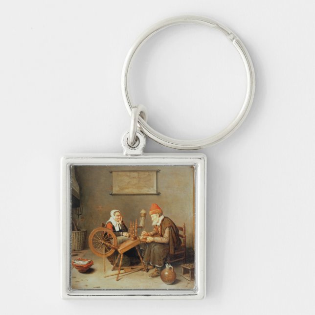 T31883 en insida med en gammal kvinna på en snurr fyrkantig silverfärgad nyckelring (Framsidan)