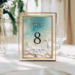 Table Number | Ethereal Shoreline Teal Ocean Bordsnummer<br><div class="desc">Complete your reception decor with the Ethereal Shoreline Teal Ocean Tide wedding table number. Featuring a striking deep turquoise and seafoam green watercolor wash with delicate gold-look splatters, this double-sided card brings the beauty of the sea to your guest tables. The clean, minimalist typography ensures that table numbers are easy...</div>