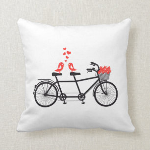 tandem cykel med gullig love birds och röda kudde