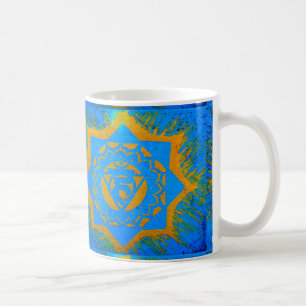Tantrikon guld i blått kaffemugg