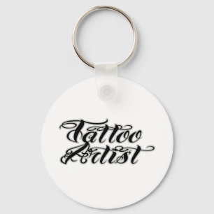 Tatueringkonstnären brännmärker att bekläda nyckelring