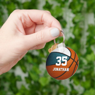 Tävliga vita ungar basketbollens sportlag färg nyckelring