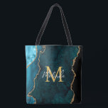Teal Blue och Guld Marble Agate Tygkasse<br><div class="desc">Den här väskan har en elegant och en glamorös marmorbakgrund med geode gemstone och faux guld glitter accents. Monogrammet kombinerar handskript och modernt sans serif typsnitt för ett klassigt och sofistikerat utseende. Detta kommer att bli den idealiska presenten eftersom den kan anpassas med namn och en början. De djupa tårblått...</div>