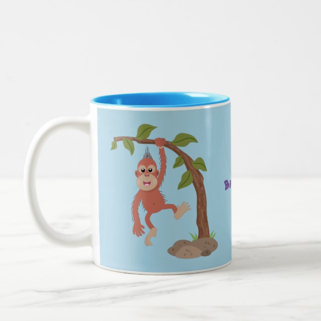 Tecknad av  Cute lycklig baby orangutan Två-Tonad Mugg (Vänster)