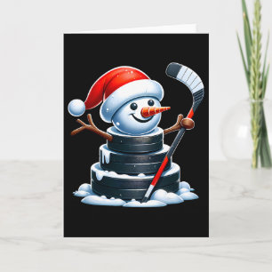 Tecknad ishockeypuck snöman med jultomte hatt Chr Kort