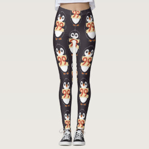 Tecknad pingvin som håller nummer 99 leggings