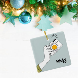 Tecknad stil-hand klicka på en kamera Ornament